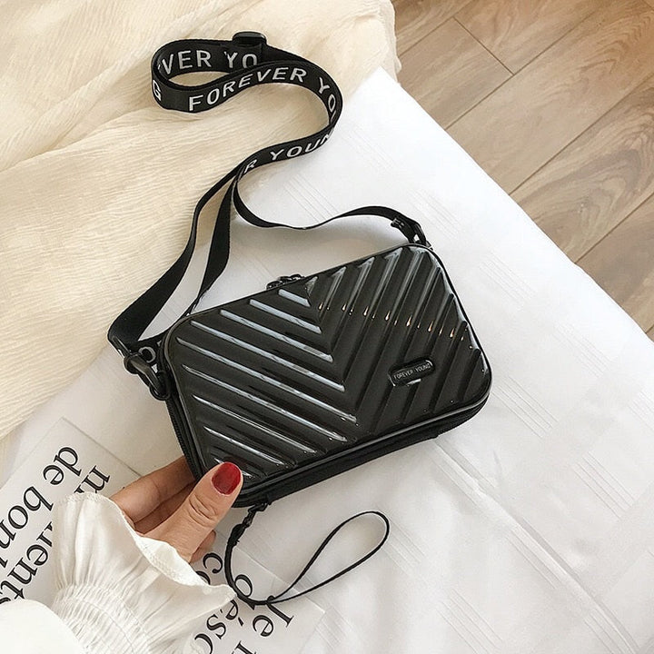 Kompakt kemény héjú utazótáska